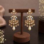 Neelika Royal Blue Polki Meenakari Pearl Drop Earrings displayed on a premium jewellery stand.