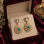 VELQORR Liora emerald heart drop earrings featuring premium kundan stones, emerald green centerpiece, and gold-plated finish.