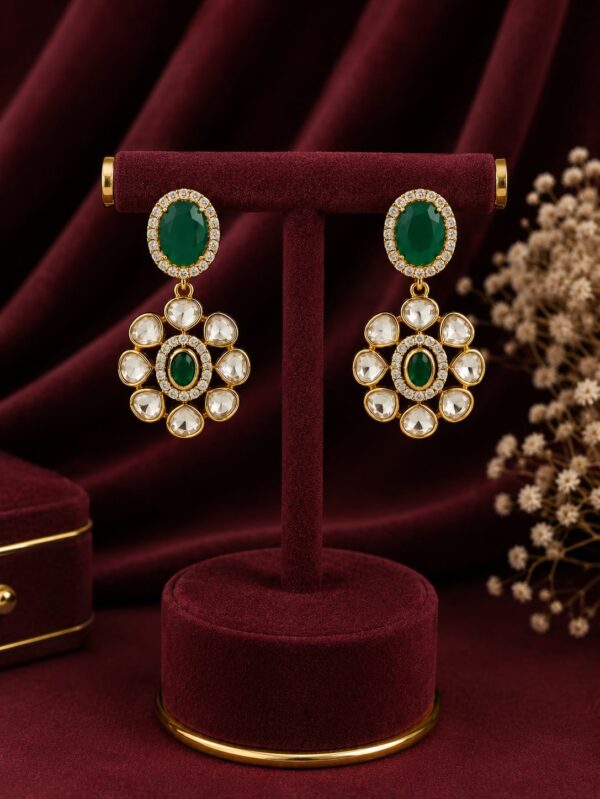 Emerald green floral drop earrings with premium kundan stones and gold-plated finish by VELQORR.
