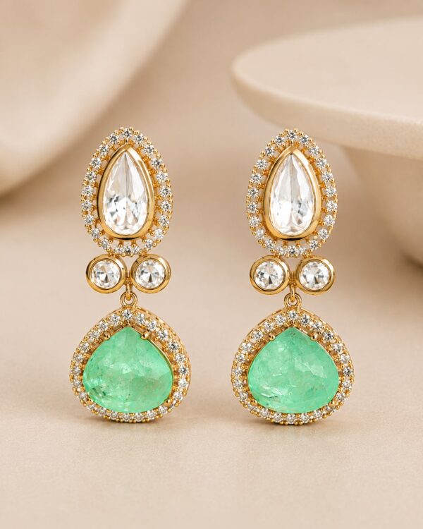 Zivara emerald-green teardrop earrings with sparkling clear stones and gold-plated detailing by VELQORR.