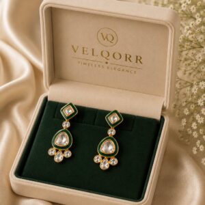 Mira emerald-green Meenakari Polki drop earrings with gold detailing by VELQORR.