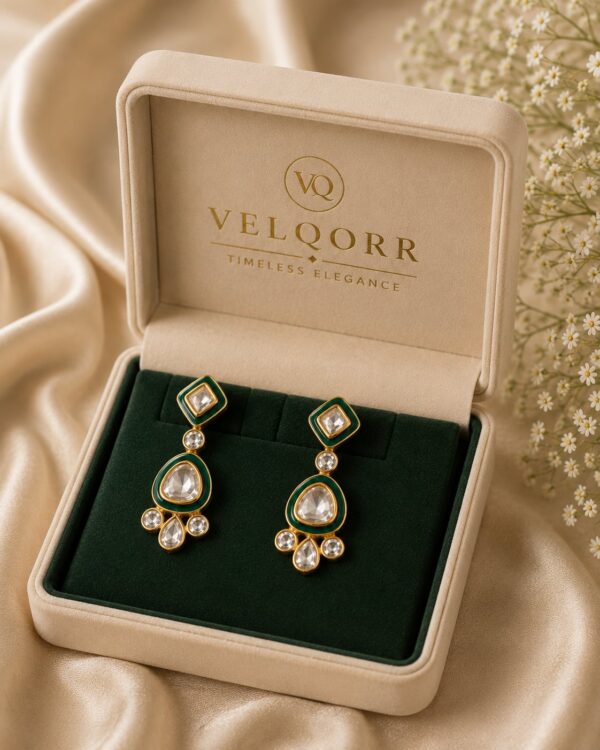 Mira emerald-green Meenakari Polki drop earrings with gold detailing by VELQORR.