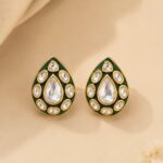 VELQORR Zareen emerald green teardrop Polki stud earrings with handcrafted Polki stones and premium gold-plated finish.