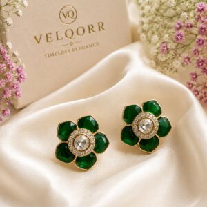 VELQORR Florielle Emerald Bloom Stud Earrings featuring emerald green floral petals with a sparkling crystal halo center.