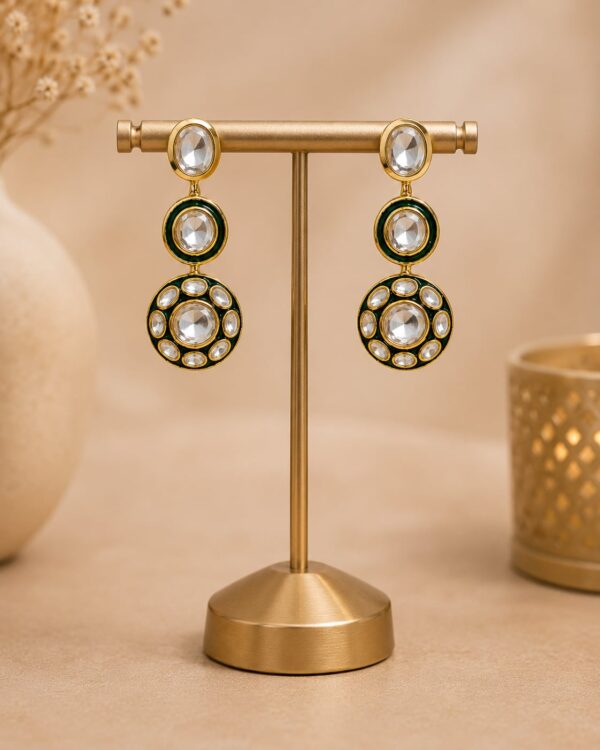 VELQORR emerald green and gold layered circular drop earrings with sparkling clear stones.