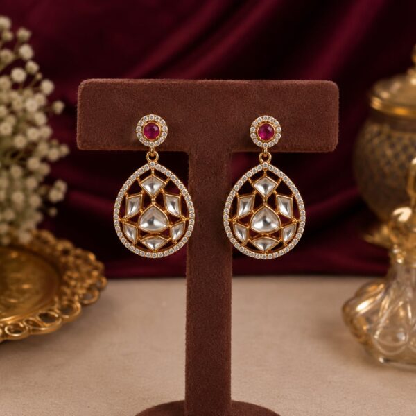 Roselle ruby-toned geometric drop earrings with white crystals and gold-toned detailing by VELQORR.