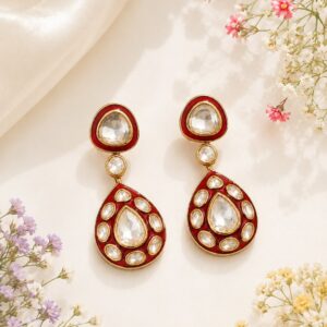 VELQORR ruby red teardrop drop earrings with sparkling clear stones and gold finish.