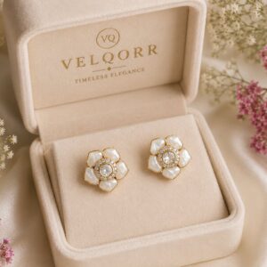 White floral stud earrings with mother-of-pearl inspired petals and sparkling cubic zirconia by VELQORR.