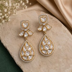 White teardrop kundan statement earrings with premium gold-plated finish by VELQORR.