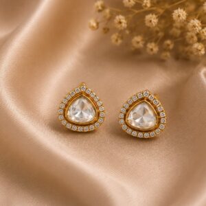 Nyla Crystal Polki Stud Earrings with clear stones and gold detailing by VELQORR.