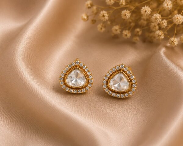 Nyla Crystal Polki Stud Earrings with clear stones and gold detailing by VELQORR.